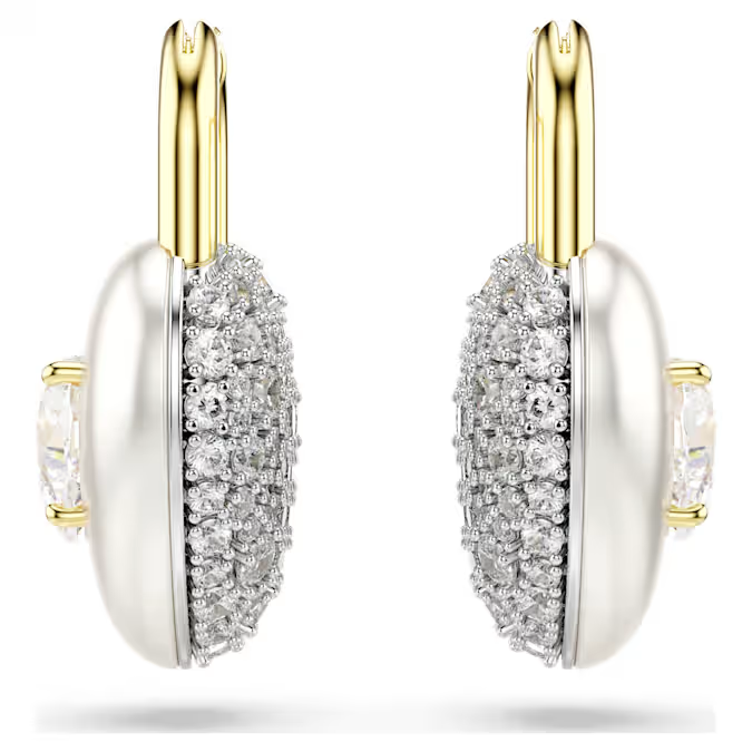 Deze Idyllia-oorbellen, ideaal voor een romantische stijl, hebben de vorm van twee hartvormige medaillons. Elk stuk met goudkleurige toplaag is aan de ene kant voorzien van ronde Swarovski Zirkonia en aan de andere kant van een enkel hartvormig kristal. Wissel beide kanten af voor nog meer passie.