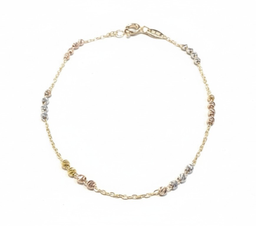 De 14k Gouden armband Ankerschakel met Bolletjes (Tricolor: geel / wit / ros&eacute;), modelnummer GA0250-TRI, combineert elegantie en veelzijdigheid met zijn driekleurige ontwerp. Ideaal als fantasiearmband, voegt het een speelse touch toe aan elke outfit. Draag hem solo voor een subtiele uitstraling of combineer met andere sieraden voor een gedurfde, modieuze look. Perfect voor elke gelegenheid.