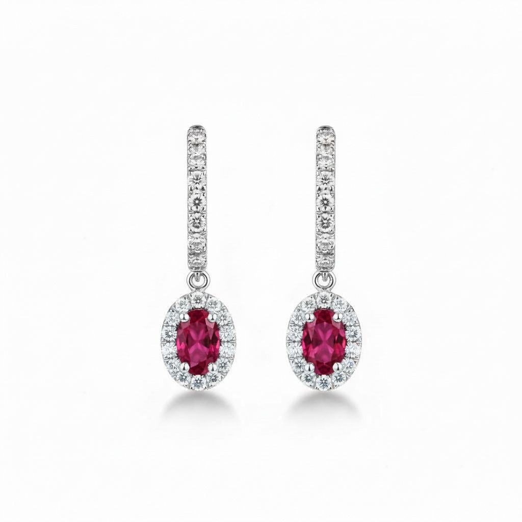 Oorhangers witgoud in 14 karaat met per hanger een robijn van 0.29ct en 23 diamanten 0.33ct