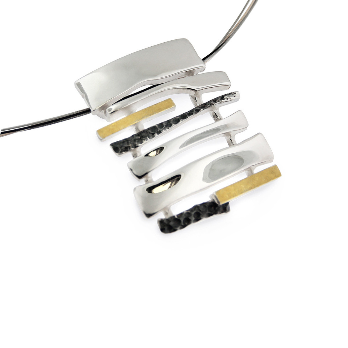 925 white silver pendant combined with oxidized silver and 18k yellow gold.