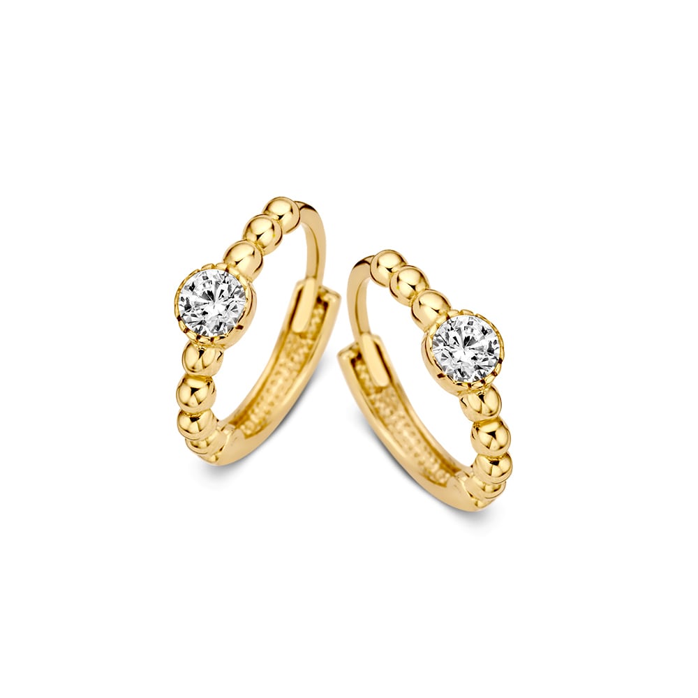 Geelgouden creolen met een zirkonia steen in een rond kastje.