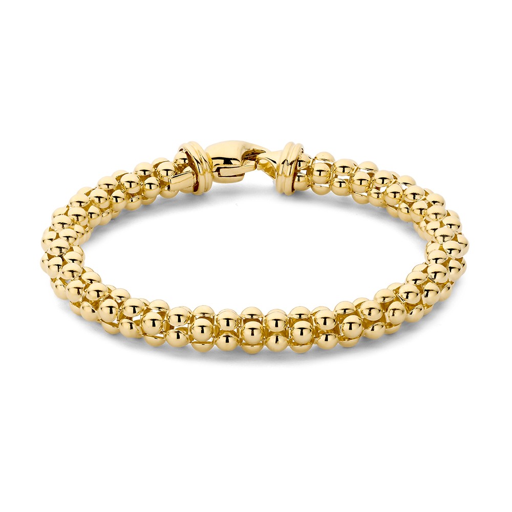 Stijlvolle gouden armband met klassiek design en luxe karabijnsluiting.