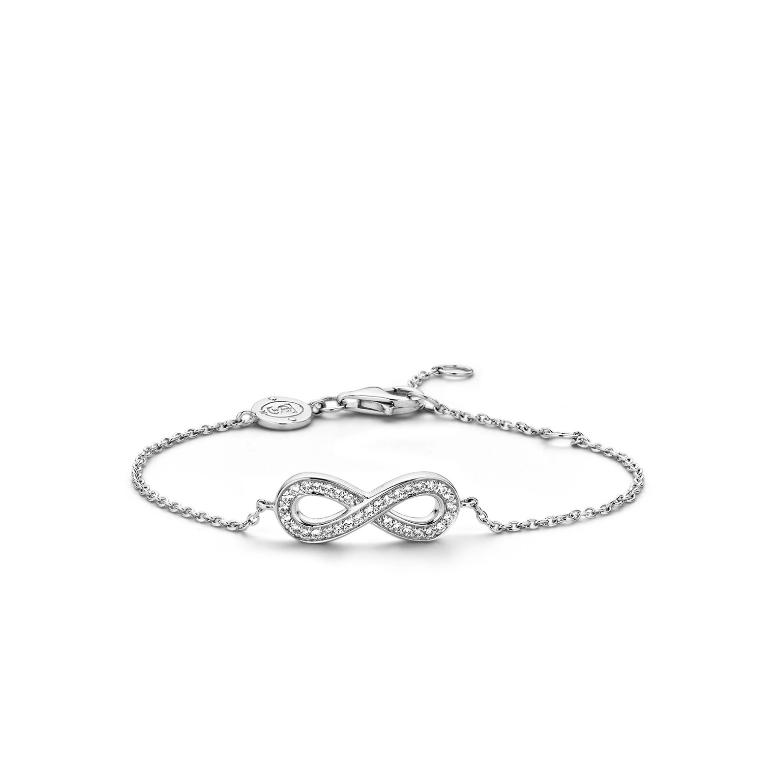 Deze luxueuze TI SENTO - Milano armband bestaat uit ovale schakels van sterling zilver die zijn voorzien van een rhodiumlaag. Het infinity teken in het midden is gemaakt van een rijzetting met briljant geslepen zirkonia's. De zetting is eveneens gemaakt van gerhodineerd sterling zilver. De armband heeft een lengte van 17 centimeter met het verlengstuk is de armband om te doen tot 22 centimeter.