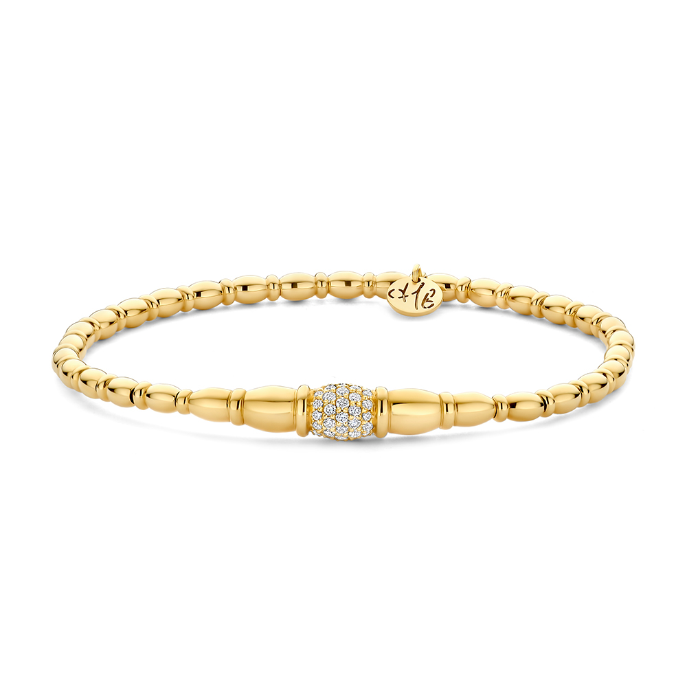 Een verfijnd juweel in 18-karaat geelgoud met een elegante, tijdloze uitstraling. Het ontwerp combineert luxueuze gouden bolletjes met het kenmerkende flexibele stretchsysteem, waardoor de armband comfortabel draagt en moeiteloos om de pols schuift.