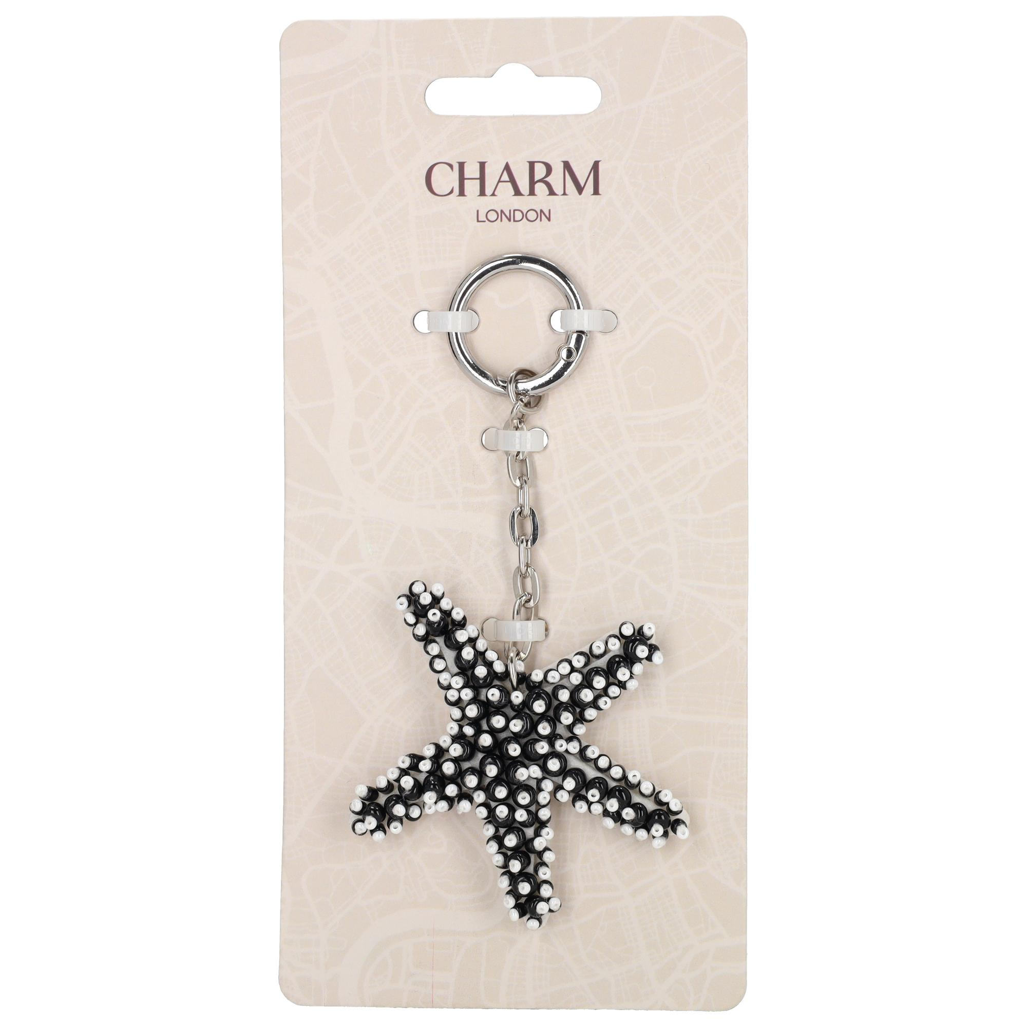 De Charm London BALI Bag Charm is een speelse en stijlvolle accessoire ge&iuml;nspireerd op de oceaan. Deze bag charm is versierd met prachtige oceaandieren zoals zeesterren en schelpen die zorgen voor een zomerse en elegante uitstraling. De combinatie van natuurlijke vormen en verfijnde details maakt deze charm perfect om je tas een unieke en frisse look te geven.