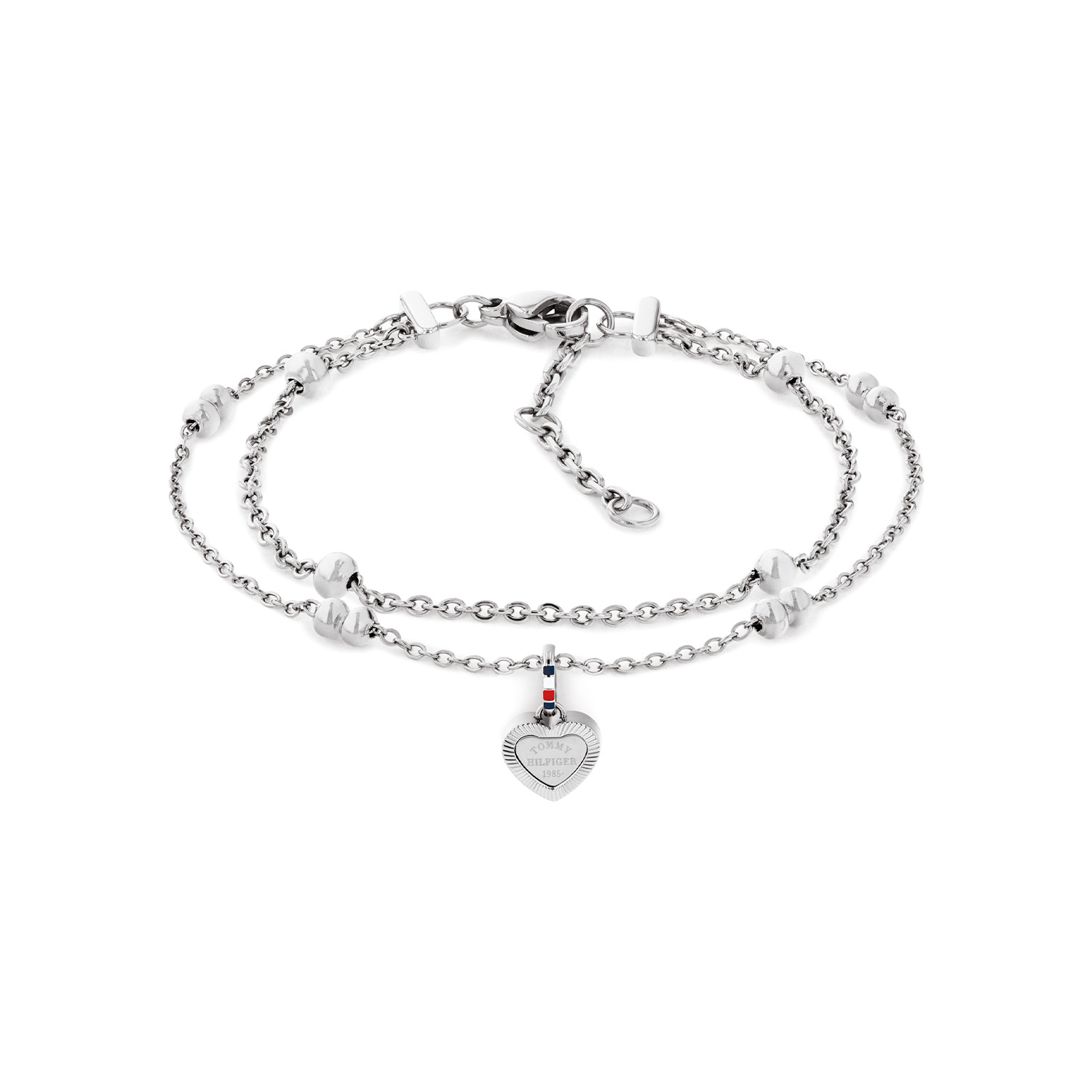 Deze Tommy Hilfiger laagjes armband  is een stijlvol en elegant sieraad met een speelse twist. De combinatie van twee fijne armbandjes zorgt voor een trendy gelaagde look, terwijl de hartvormige hanger een subtiel en betekenisvol detail toevoegt. Het verfijnde ontwerp maakt deze armband perfect voor zowel dagelijks gebruik als speciale gelegenheden. De damesarmband is verstelbaar en heeft een totale lengte van 19cm. Leuk te combineren met andere sieraden uit deze serie.

Het merk:
Tommy Hilfiger is wereldwijd &eacute;&eacute;n van de grootste designer lifestyle merken en is internationaal bekend om haar classic American cool stijl. De sieraden zijn voor dames en heren met een eigen stijl, die niet bang zijn om dit aan de wereld te laten zien.

Specificaties:
- Dames armband
- Materiaal: Staal 
- Lengte 19cm verstelbaar
- Ideaal als cadeau of voor jezelf