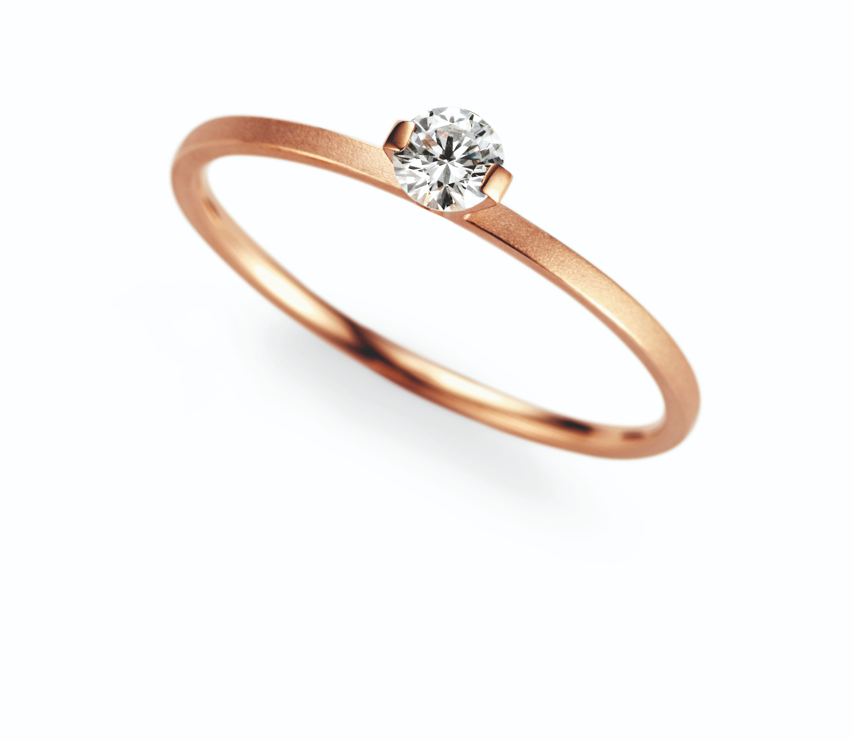 een 18 krt rosegouden ring Niessing model Princess, met een diamant briljant geslepen 0.16 crt.