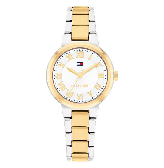 Dit Tommy Hilfiger Dameshorloge BECA 1782903 heeft een roestvrijstalen kast en een goud-zilver gekleurde band. Het horloge heeft een kwartsuurwerk, een ronde vorm en een mineraalglas met Romeinse cijfers. Geen datumaanduiding. Past perfect bij zowel formele als casual outfits. Draag het met stijlvolle armbanden voor een elegante look.