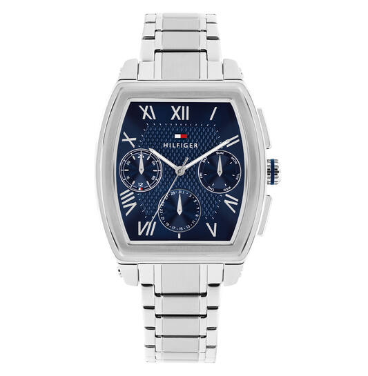 De Tommy Hilfiger TH-OXFORD horloge (modelnummer 1710763) biedt stijl en functionaliteit. Kenmerken: analoge blauwe wijzerplaat, zilverkleurige roestvrijstalen band, kwartsuurwerk, mineraalglas, waterbestendig (3atm) en nikkelvrij. Ideaal voor formele gelegenheden of dagelijks gebruik. Combineer met een zilverkleurig armbandje voor een verfijnde look. Datering en Romeinse cijfers complementeren de elegante tonneau-vormige kast.