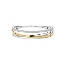 De TI SENTO Bracelet Gilded met modelnummer 23094ZY is een prachtige, vergulde armband. Deze elegante armband valt onder de categorie 'Jewel' en het type 'Bracelet'. Draag hem solo voor een subtiele look of combineer met andere sieraden voor een trendy, gelaagde stijl. Perfect voor zowel alledaagse als speciale gelegenheden.