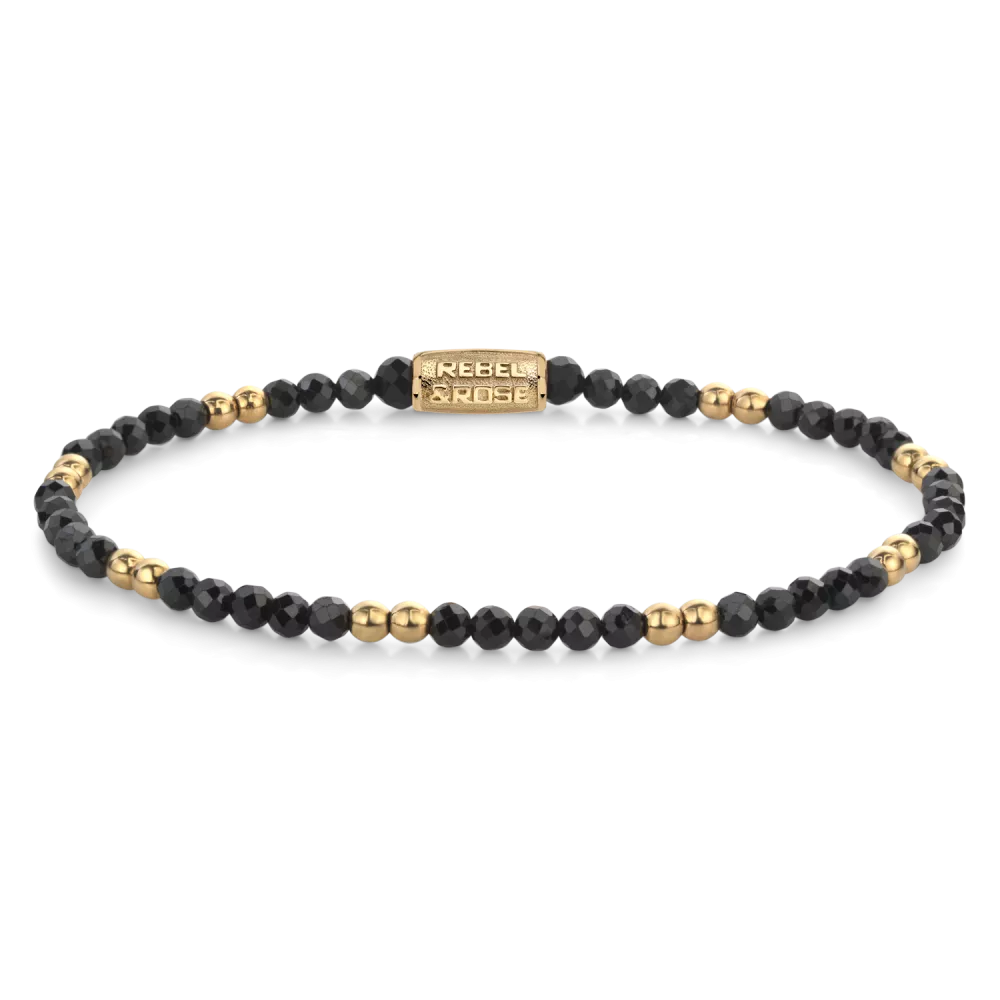Bead armband met 3mm Black Spinel stenen, en 3mm 18 karaat goud ion-plated edelstalen stenen. De sluiting is gemaakt van 18 karaat goud ion-plated edelstaal. Het Rebel & Rose sieraad is handgemaakt en makkelijk te combineren met onze andere kralenarmbanden.