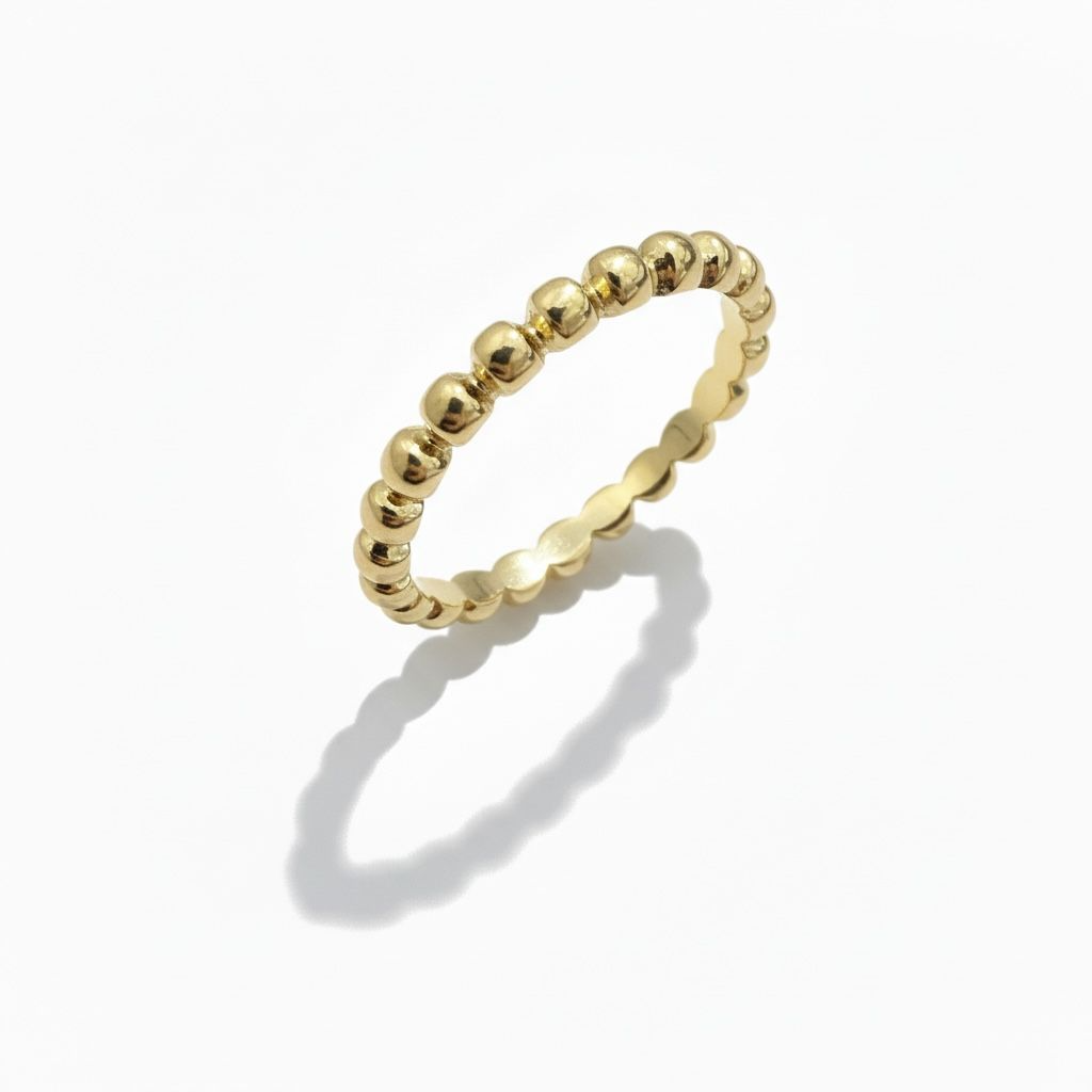 14 karaat geelgouden (aanschuif)ring afgewerkt met bolletjes.