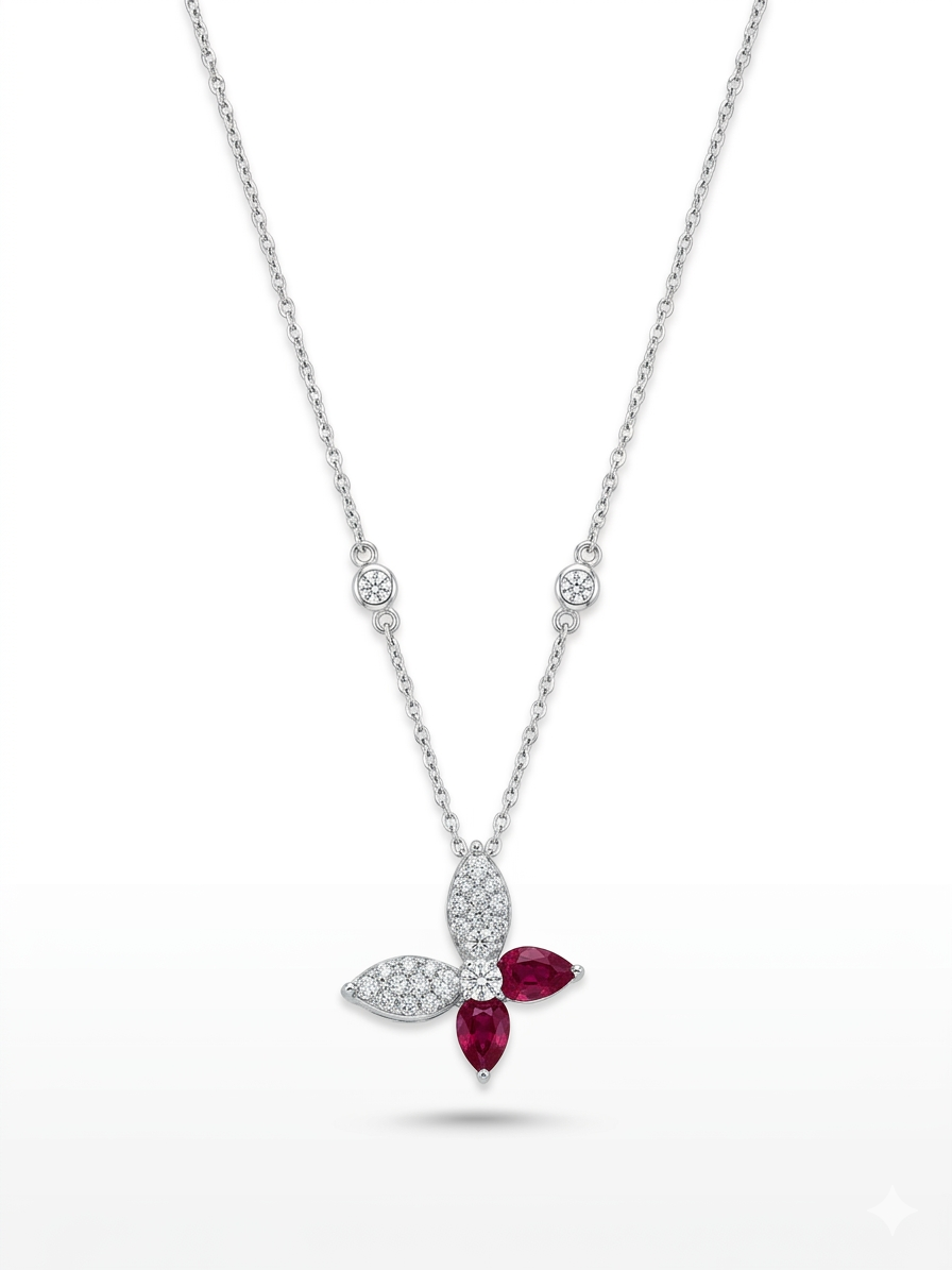Deze 18 karaat witgouden ketting, modelnummer AN4247, met een vlinderontwerp, is bezet met 53 briljant geslepen diamanten  en schitterende robijnen. Perfect voor elegante gelegenheden, geeft het een verfijnde touch aan elke outfit. Draag het met een mooie avondjurk of als een opvallend accessoire bij dagelijks chique kleding. Een tijdloos juweel voor elke garderobe.