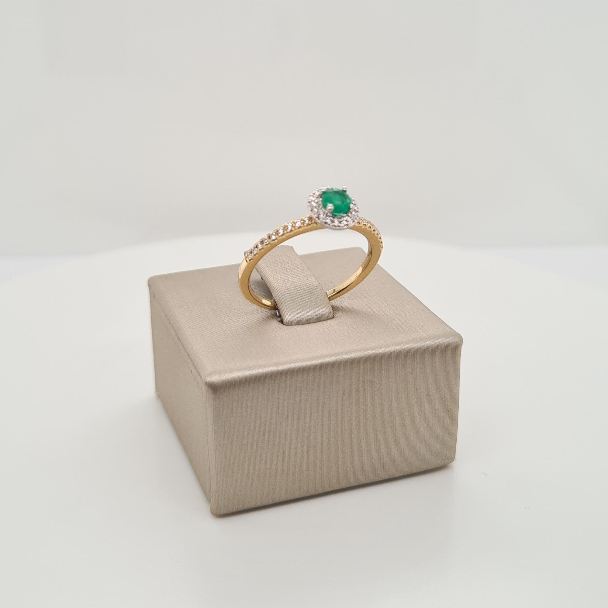 14krt gouden ring met diamant en smaragd