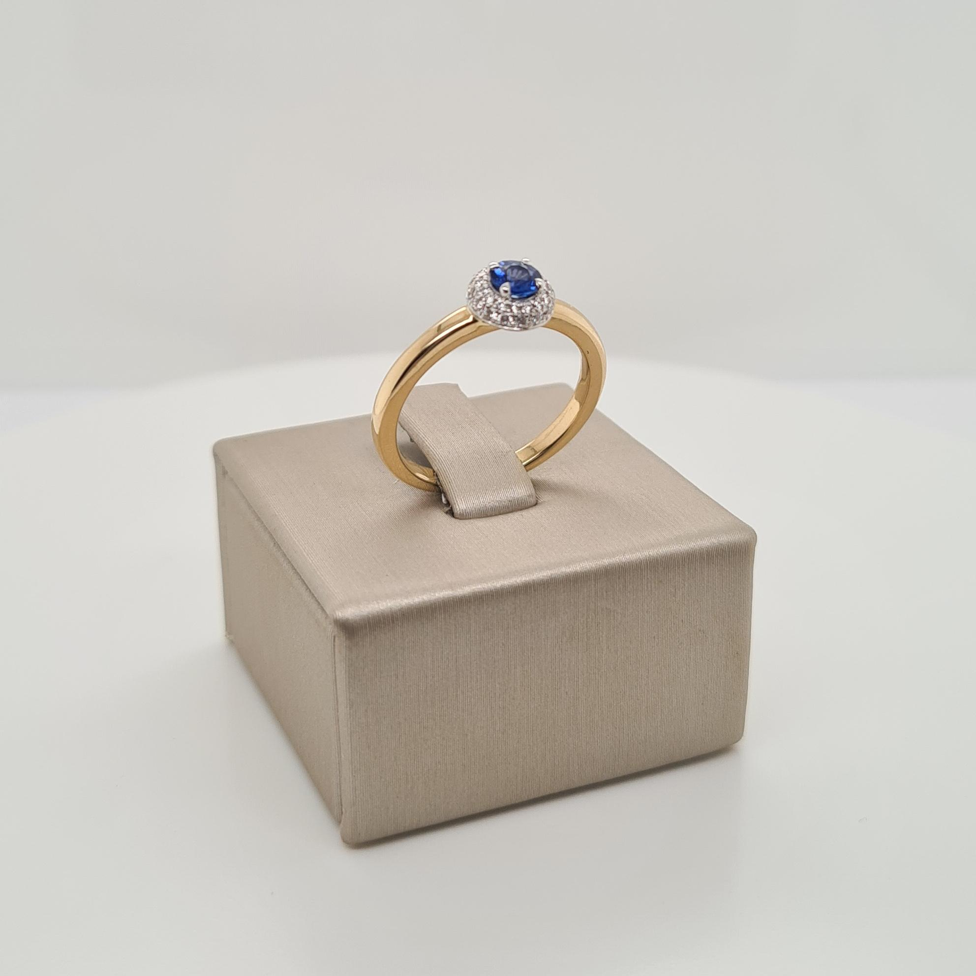 14krt gouden ring met diamant en blauw saffier