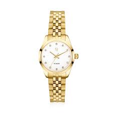 Horloge van verguld roestvrij staal, gepolijst en geborsteld oppervlak, met saffierglas en een witte wijzerplaat met witte zirkonia's. Waterdicht tot 50 meter. Uurwerk: Miyota.