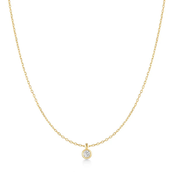A single bezel-set stone rests on a delicate chain&mdash;quiet enough to wear alone, versatile enough to anchor any stack. Stack it up with a pendant necklace or keep it solo for everyday polish, adapting to every mood and every layer you choose.
Product Details:
&bull; Material: 925 Sterling Silver with 14kt Gold Plating with Cubic Zirconia
&bull; Necklace Length: 40.5mm with 75mm extender
&bull; Weight: 2.0g
Presented in official gift ANIA HAIE packaging