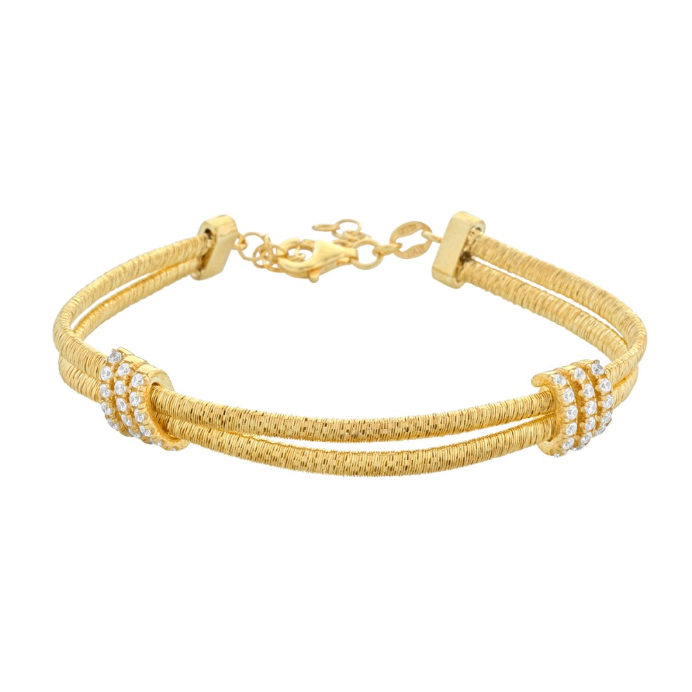 Zijden knooparmband - Kasjmier
De Silk Knot Bracelet - Cashmere is gemaakt van verguld 925 zilver met een speciaal proces voor een zijdeachtig effect, en is versierd met een pav&eacute;zetting van witte stenen.