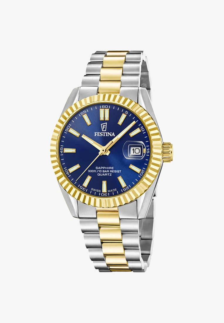 De F20085/B polshorloge is een stijlvol horloge met een ingebouwde datumfunctie, ideaal voor dagelijks gebruik. Draag deze klok om je pols voor een verfijnde en tijdloze uitstraling. Perfect voor elke gelegenheid, van zakelijke bijeenkomsten tot casual uitjes. Voeg deze veelzijdige en functionele accessoire toe aan je collectie.
