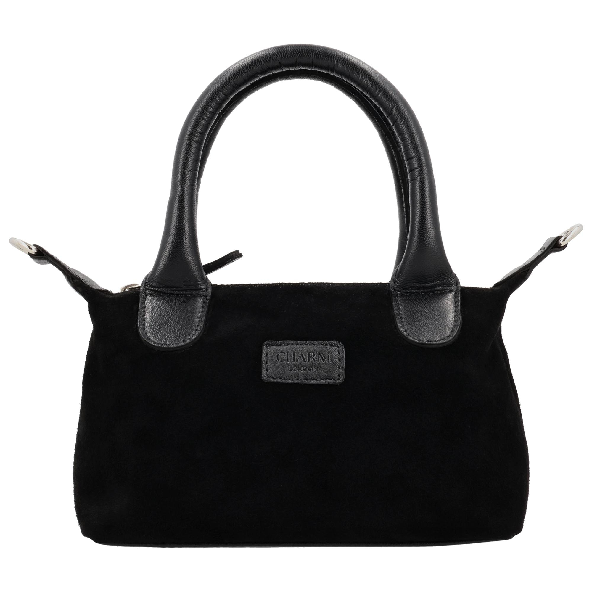 De Charm London Buckingham Royale Handtas is een elegante en luxe tas met een zachte su&egrave;de look, prachtig afgewerkt met leren details. De tas sluit met een rits zodat je je spullen veilig opbergt en de stijlvolle uitstraling behouden blijft. Binnenin vind je een ritsvak waarmee je je essentials netjes organiseert.

De handtas wordt geleverd met een verstelbare en afneembare schouderband waardoor je haar zowel in de hand, over de schouder als crossbody draagt. Het compacte, luxe ontwerp maakt deze tas ideaal voor dagelijks gebruik of een chique gelegenheid.

Kenmerken:


&bull; Luxe handtas met su&egrave;de look
&bull; Afgewerkt met leren details
&bull; Sluiting met ritssluiting
&bull; Binnenvak met rits
&bull; Verstelbare en afneembare schouderband