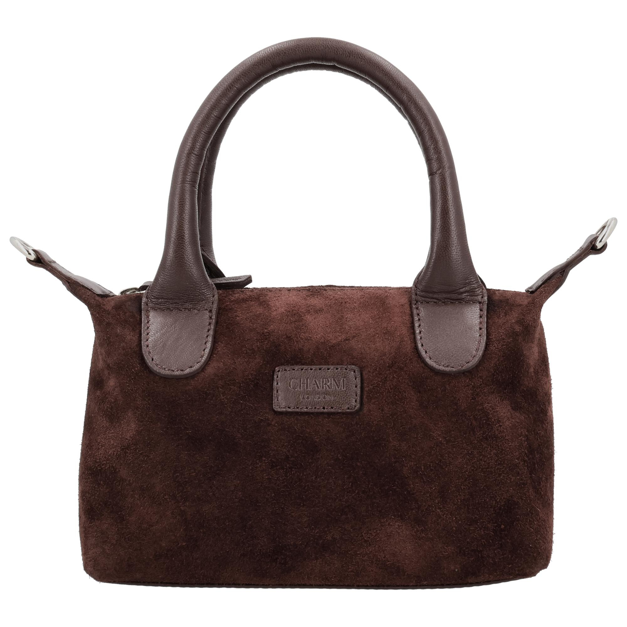 De Charm London Buckingham Royale Handtas is een elegante en luxe tas met een zachte su&egrave;de look, prachtig afgewerkt met leren details. De tas sluit met een rits zodat je je spullen veilig opbergt en de stijlvolle uitstraling behouden blijft. Binnenin vind je een ritsvak waarmee je je essentials netjes organiseert.

De handtas wordt geleverd met een verstelbare en afneembare schouderband waardoor je haar zowel in de hand, over de schouder als crossbody draagt. Het compacte, luxe ontwerp maakt deze tas ideaal voor dagelijks gebruik of een chique gelegenheid.

Kenmerken:


&bull; Luxe handtas met su&egrave;de look
&bull; Afgewerkt met leren details
&bull; Sluiting met ritssluiting
&bull; Binnenvak met rits
&bull; Verstelbare en afneembare schouderband