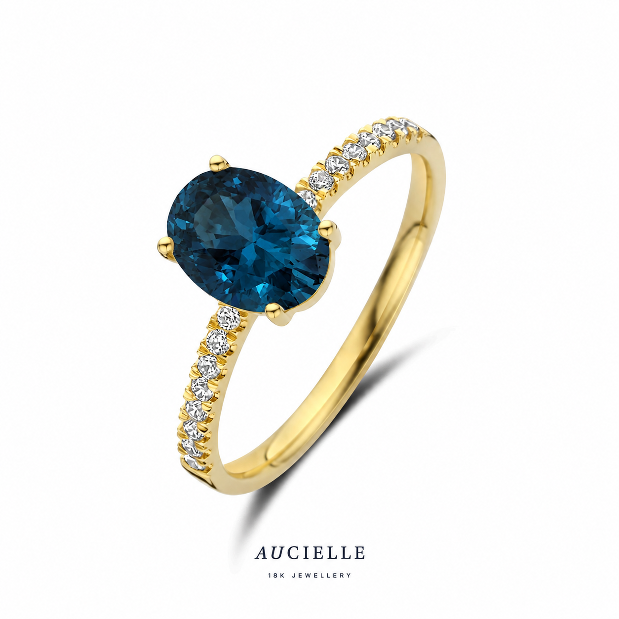 Ring YG ovaal London blauwe topaas met CZ zijstenen