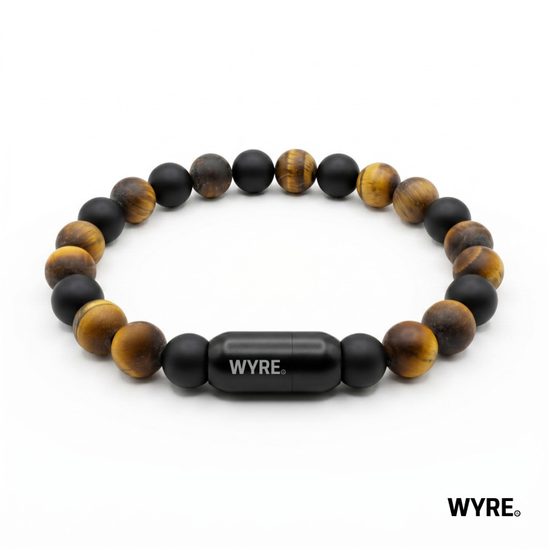 The Eclipse - Tijgeroog & Zwarte Agaat
Ontdek de perfecte balans tussen natuurlijke elegantie en industri&euml;le kracht. De The Eclipse armband is niet zomaar een sieraad; het is een statement van karakter. De combinatie van de warme, goudgele gloed van de Frost Gele Tijgeroog en de diepe, matte textuur van de Frost Zwarte Agaat zorgt voor een tijdloze look die bij elke outfit past.

Wat deze armband ook uniek maakt, is de onzichtbare kracht binnenin. Vergeet elastiekjes die knappen; deze kralen zijn geregen aan een ijzersterke metalen interne draad, waardoor de armband vrijwel onbreekbaar is. De strakke, zwarte magneetsluiting zorgt ervoor dat je de armband moeiteloos omdoet, terwijl hij de hele dag stevig om je pols blijft zitten.

✓ Unisex
✓ 8mm natuurstenen Frost Gele Tijgeroog en Frost Black Agate
✓ Stevige, stainless steel magnetische sluiting.
✓ Handgemaakt in Nederland.
✓ Inclusief metalen luxe WYRE travel/cadeau case.