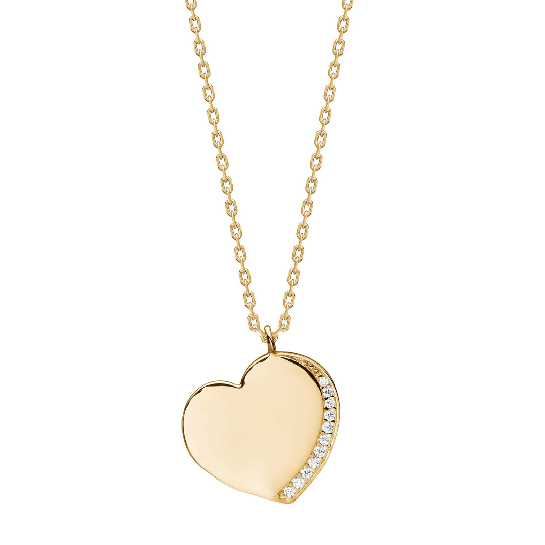 Die Kette mit Anh&auml;nger Herz, Modellnummer 20452525900, besticht durch ihr elegantes Design aus goldplattiertem Material und funkelnden Zirkonia-Steinen. Sie misst 42 cm und eignet sich ideal als zartes Statement-Piece. Die Kette l&auml;sst sich am besten zu einem tiefen Ausschnitt oder &uuml;ber einem schlichten Oberteil tragen, um das gl&auml;nzende Herzmotiv optimal zur Geltung zu bringen.