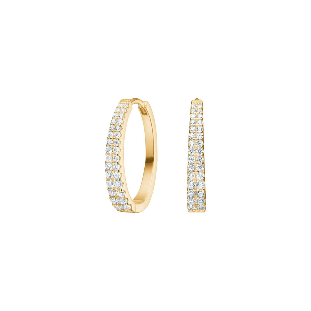 Die Creolen GP Zirkonia, Modellnummer 30454565900, sind elegante Hoop-Ohrringe, verziert mit funkelnden Zirkonia-Steinen. Diese Ohrringe eignen sich perfekt f&uuml;r festliche Anl&auml;sse oder um jedem Outfit einen Hauch von Glamour zu verleihen. Kombinieren Sie die Creolen mit hochgestecktem Haar oder einem schlichten Kleid, um die funkelnde Eleganz hervorzuheben. Perfekt f&uuml;r besondere Momente!