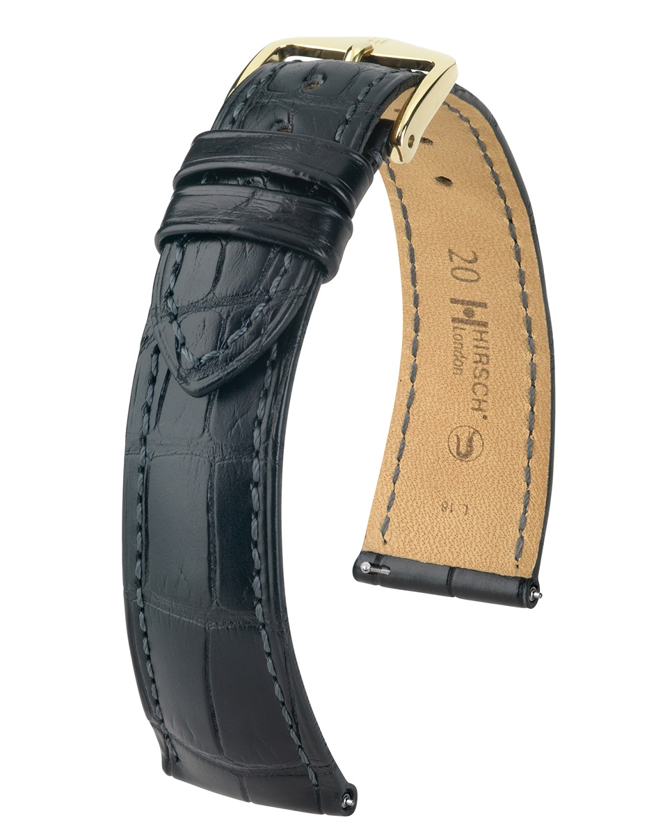 De Hirsch London 04207059-1-20 is een exclusieve horlogeband van echt alligatorleer, uitgevoerd in stijlvol zwart met een luxe goudkleurige gesp. Dankzij de hoogwaardige afwerking en de zachte Hirsch Softglove-voering biedt deze band een uitzonderlijk draagcomfort en een verfijnde uitstraling. Met een breedte van 20 mm is deze premium band de perfecte keuze voor wie zijn horloge een tijdloze en elegante upgrade wil geven.