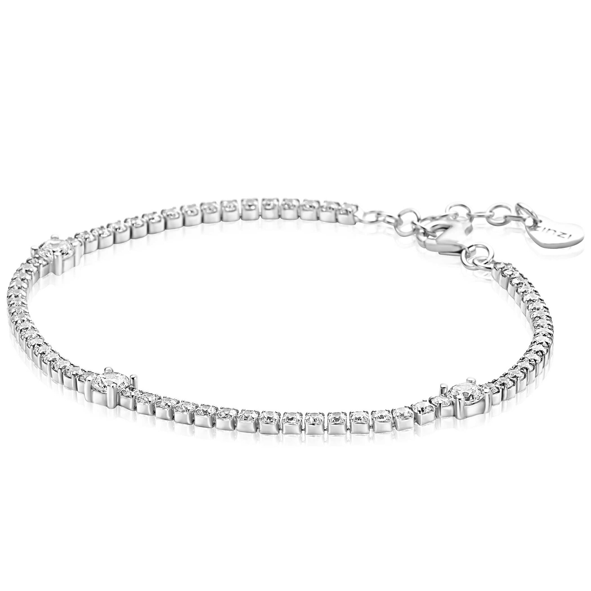 ZINZI zilveren tennisarmband 2,1mm breed bezet met witte zirkonia&rsquo;s in verfijnde rijzetting, afgewisseld met drie grotere witte zirkonia's (4,3mm) in chatonzetting. Voor een perfecte pasvorm is de lengte verstelbaar van 17cm tot 19,5cm. Vervaardigd van eerste gehalte zilver (925) en voorzien van een extra rodiumlaag voor een langdurige glans.