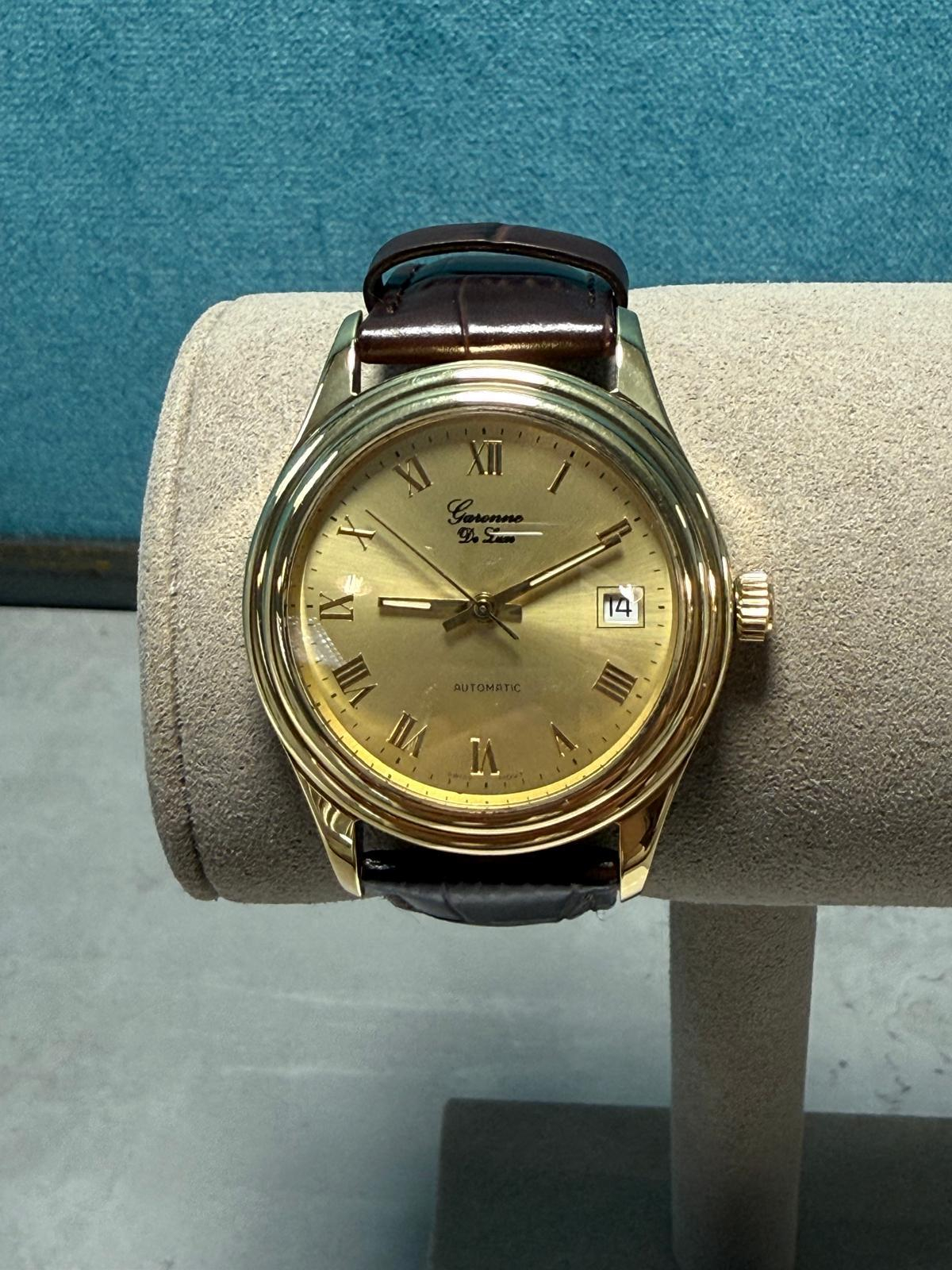 Gouden heren horloge bruin lederen band 18krt saffierglas