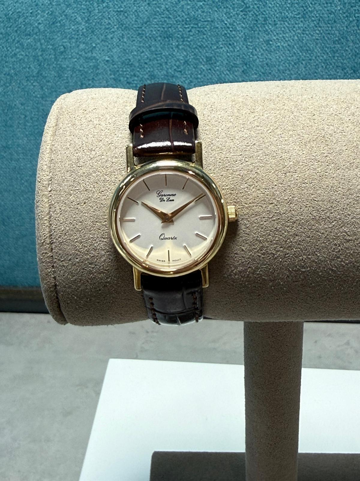 Gouden dames horloge bruin lederen band
