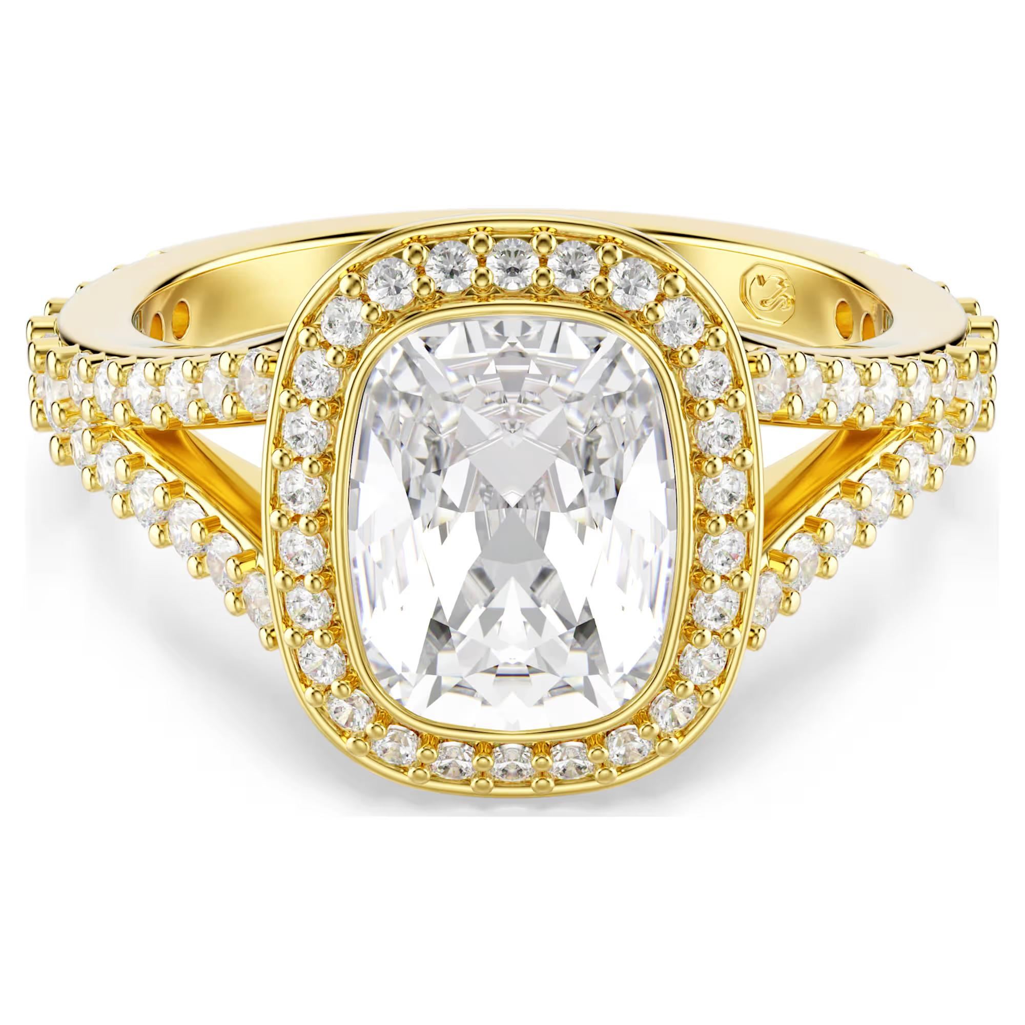 Deze stralende ring heeft een helder kristal in het midden, uitgevoerd in een langwerpige Cushion-slijpvorm en omringd door glinsterende pav&eacute;. Het is een prachtig voorbeeld van Swarovski&rsquo;s meesterschap van licht. Draag de ring wanneer je je look net een beetje extra glans wilt geven. De Una Angelic-lijn brengt een hypnotiserende beweging en weergaloze halo&rsquo;s tot leven, wat zorgt voor een prachtig lichtspel dat je gewoon moet zien om te geloven.

Artikelnr.: 5762629
Collectie: Una
Materiaal: Kristallen, 18k gouden afwerking, Cubic zirconia
Kleur: Wit