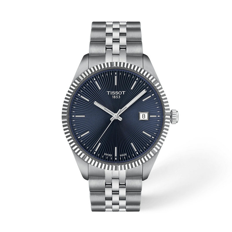 De Tissot Ballade T1564101104100 is een elegante polshorloge met een zilverkleurige roestvrijstalen kast en band, een blauwe wijzerplaat met streeppatroon en saffierglas. Het heeft een Zwitsers quartz uurwerk, datumfunctie, en is waterdicht tot 10 atm. Perfect om zowel formeel als casual te dragen. 
