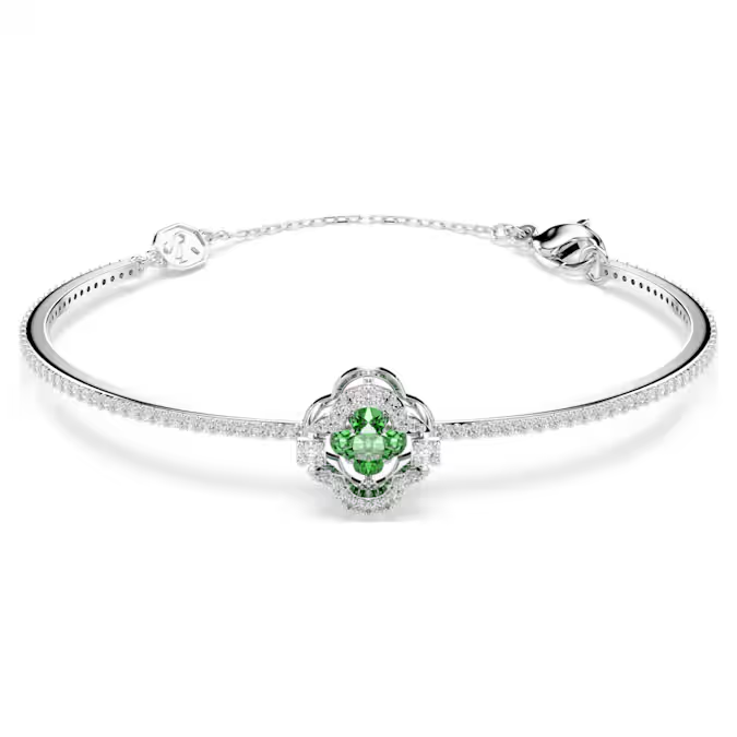 Deze verfijnde armband is ge&iuml;nspireerd op de zachte vormen van een klavertje. In het midden schittert een felgroene Swarovski Zirkonia, omringd door vloeiende pav&eacute; die vanuit elke hoek de aandacht trekt. De Una Angelic-lijn brengt een hypnotiserende beweging en weergaloze halo&rsquo;s tot leven, wat zorgt voor een prachtig lichtspel dat je gewoon moet zien om te geloven.

Artikelnr.: 5757791
Collectie:  Una
Lengte: 16.8 cm
Binnenste diameters: 5.9 x 4 cm
Formaat motief: 1.1 x 1.1 cm
Afstand opening: 4.5 cm
Materiaal:  Rodium-verguld, Cubic zirconia
Kleur:  Groen
Type sluiting:  Karabijn