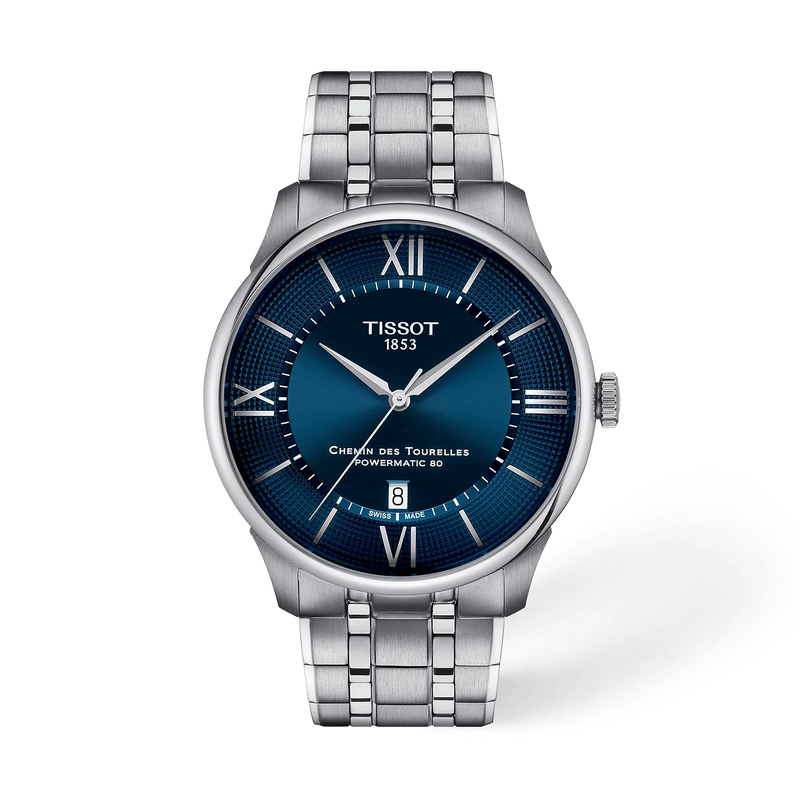 De Tissot Chemin Des Tourelles T1394071104800 is een elegante automatische Zwitserse polshorloge met een blauwe wijzerplaat en Romeinse index. Het heeft een saffierglas, een roestvrijstalen kast en band, en is waterbestendig tot 5 bar. Draag het tijdens formele gelegenheden voor een stijlvolle en tijdloze uitstraling.