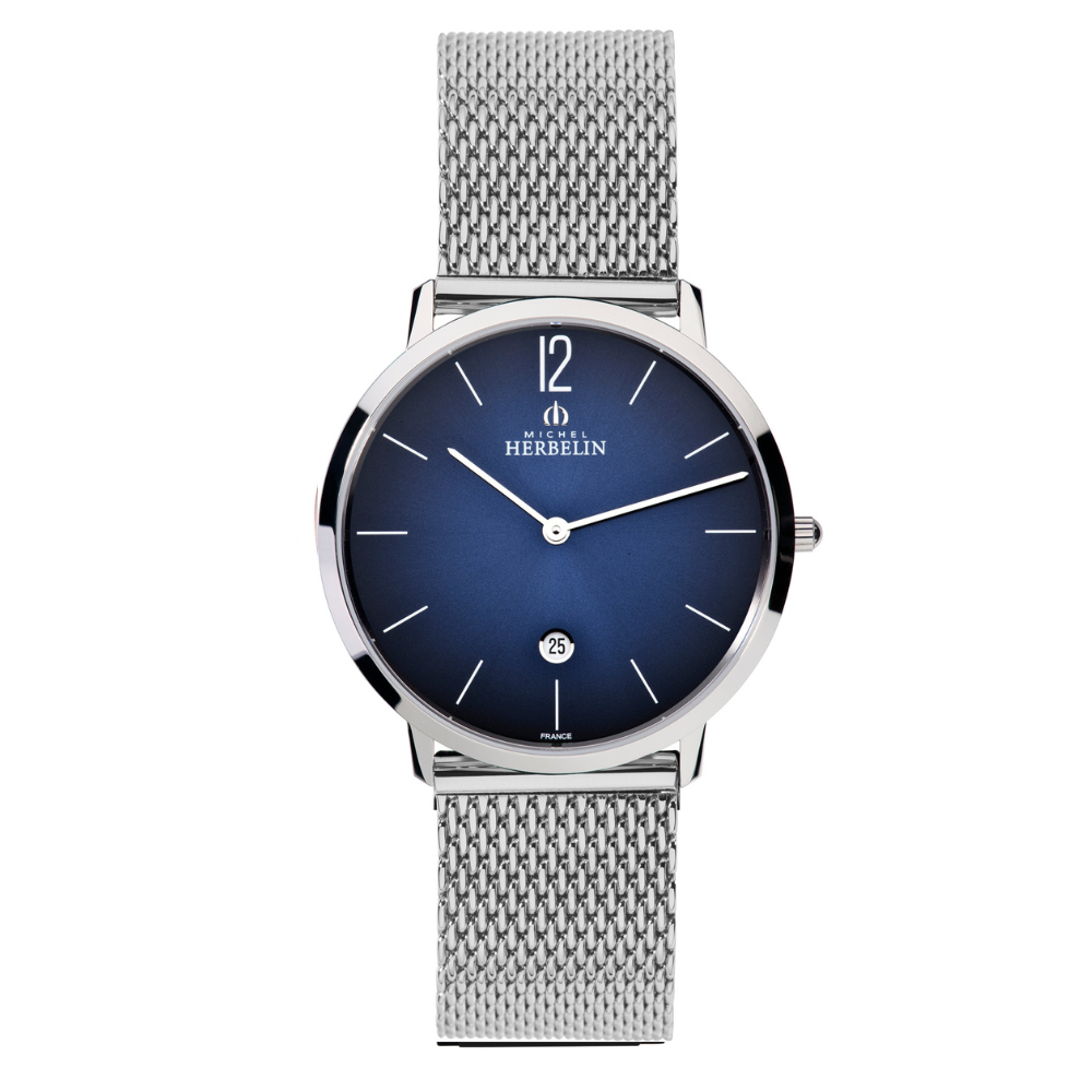 De Herbelin City is een stijlvol Frans herenhorloge met een slanke roestvrijstalen kast, elegante milanese meshband en een diepblauwe sunray wijzerplaat. Het krasbestendige saffierglas, betrouwbare Zwitserse quartz-uurwerk en tijdloze uitstraling maken dit horloge perfect voor zowel zakelijke als casual gelegenheden.