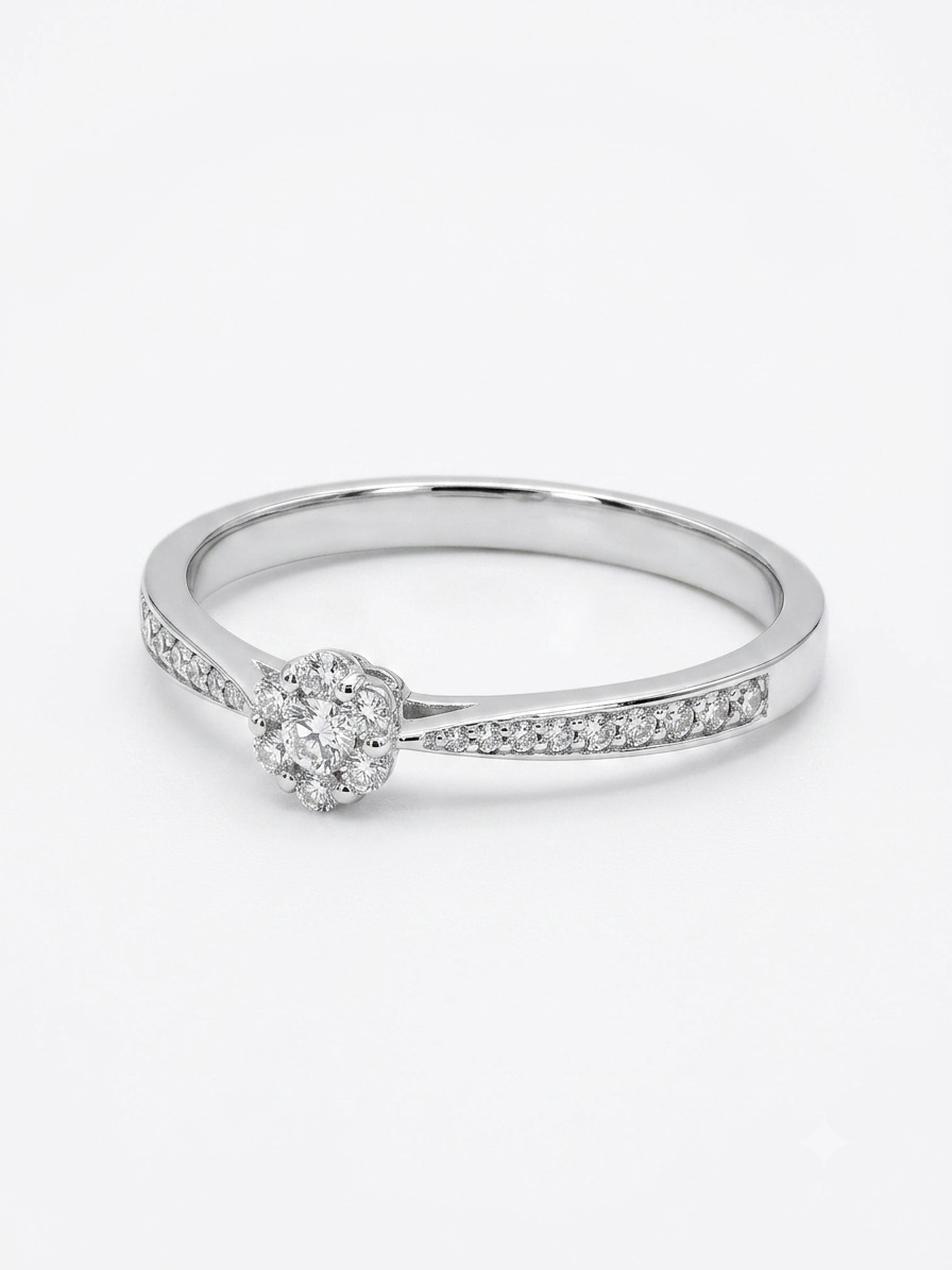 Exclusieve 14k Witgouden Verlovingsring met Diamant Cluster & Pav&eacute;band (0.17 ct)

Ben je op zoek naar een verfijnde en schitterende blikvanger tussen de verlovingsringen in Amsterdam? Bij Juwelier Rijk Amsterdam presenteren we deze adembenemende ring van massief 14 karaat witgoud. Het middelpunt van de ring is ontworpen met een vakkundig gezette, bloemvormige cluster van meerdere kleinere diamanten. Deze schitterende centrale zetting wordt prachtig ondersteund door de elegant toelopende band, die aan weerszijden is ingezet met een fonkelende rij pav&eacute; diamanten. Met een totaal diamantgewicht van 0,17 karaat biedt deze ring een subtiele, maar intense schittering.

Dankzij de hoogwaardige afwerking en de stevige kwaliteit van het massieve goud is deze ring uitermate geschikt voor dagelijks gebruik. Het slanke ontwerp draagt uiterst comfortabel aan de vinger&mdash;een tijdloos juweel dat speciaal is ontworpen om h&eacute;t perfecte aanzoek te bezegelen en een leven lang mee te gaan.

Waarom kopen bij Juwelier Rijk Amsterdam?

Hoogwaardige Materialen: Vervaardigd uit echt, massief 14 karaat witgoud en bezet met 0,17 karaat aan fonkelende, natuurlijke diamanten.

Kosteloos op Maat Gemaakt: Wij zorgen ervoor dat het grote moment vlekkeloos verloopt. Deze verlovingsring wordt in ons eigen atelier geheel gratis op maat gemaakt voor de perfecte pasvorm.

Persoonlijke Service: Wil je de verfijnde details en schittering van deze ring liever eerst in het echt bewonderen? Je bent van harte welkom in onze winkel om onze exclusieve collectie verlovingsringen in Amsterdam te komen passen.

Maak het moment onvergetelijk met een ring die pure elegantie uitstraalt. Bestel deze witgouden diamantring vandaag nog online of breng een bezoek aan Juwelier Rijk Amsterdam!