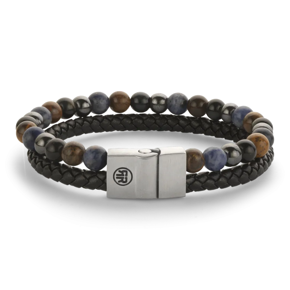 Rebel armband met stalen sluiting. Zwarte leren band en kralen (sodaliet, tijgeroog, blauw en hematiet)