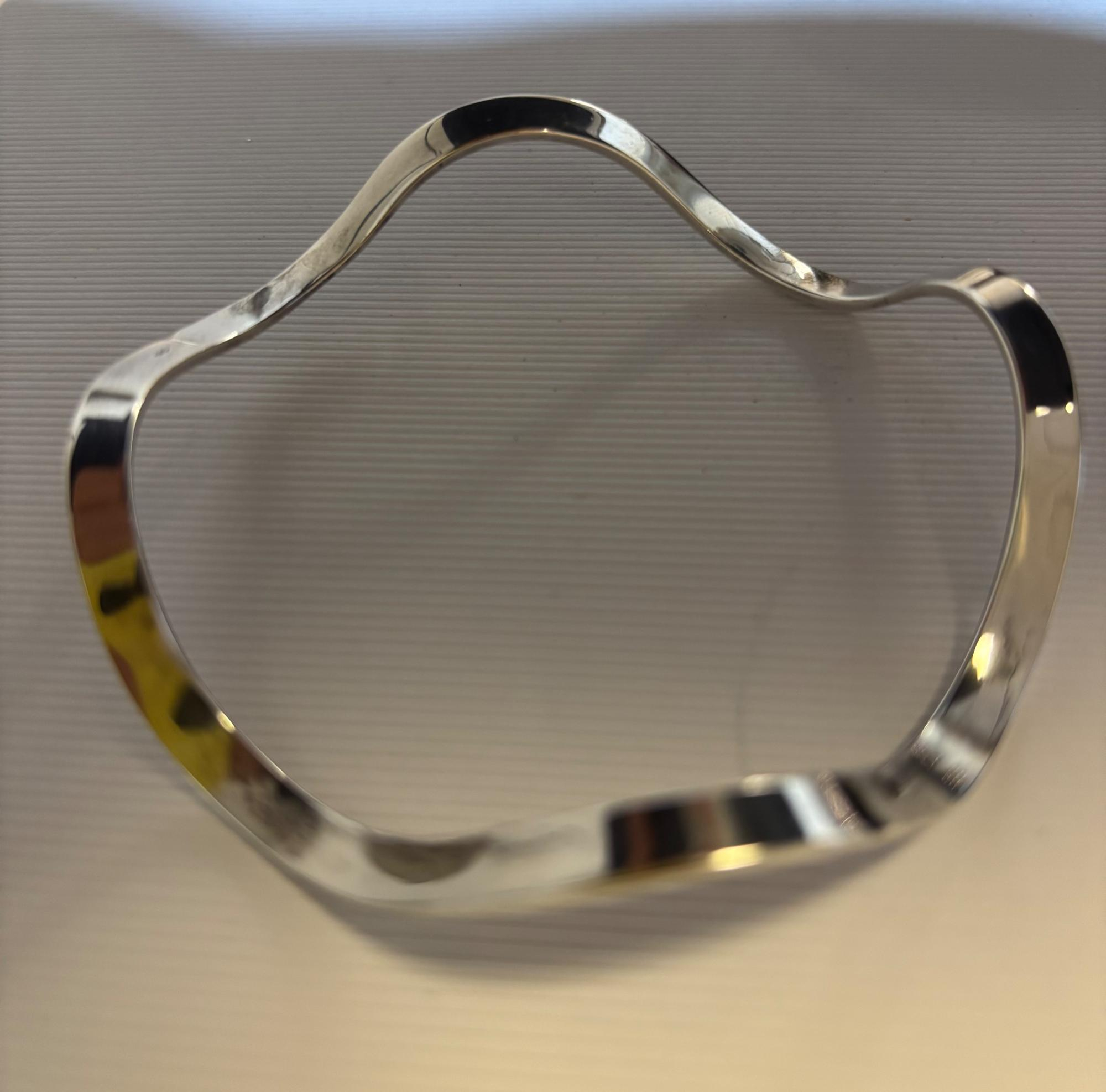 Zilveren bangle golf