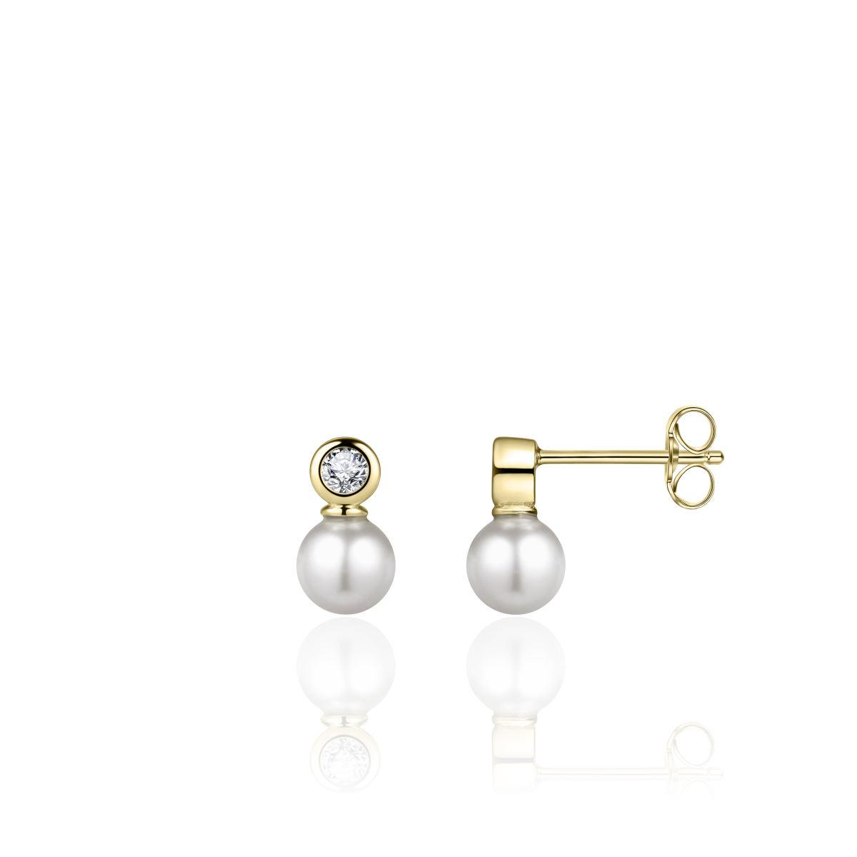 Deze Gisser zilver vergulde oorknoppen bevat een parel van 6mm en zirkonia van 2mm, met modelnummer E1027/6Y. Ideaal voor een verfijnde uitstraling bij elke gelegenheid, passen deze oorbellen perfect bij zowel casual als formele outfits. Draag ze om je look elegant en stijlvol af te maken. Categorie: Sieraad, Type: Oorknopjes.