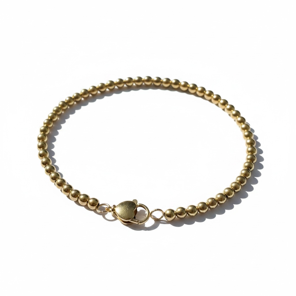 14 karaats geelgouden bolletjes armband met een lengte van 19.5 cm.