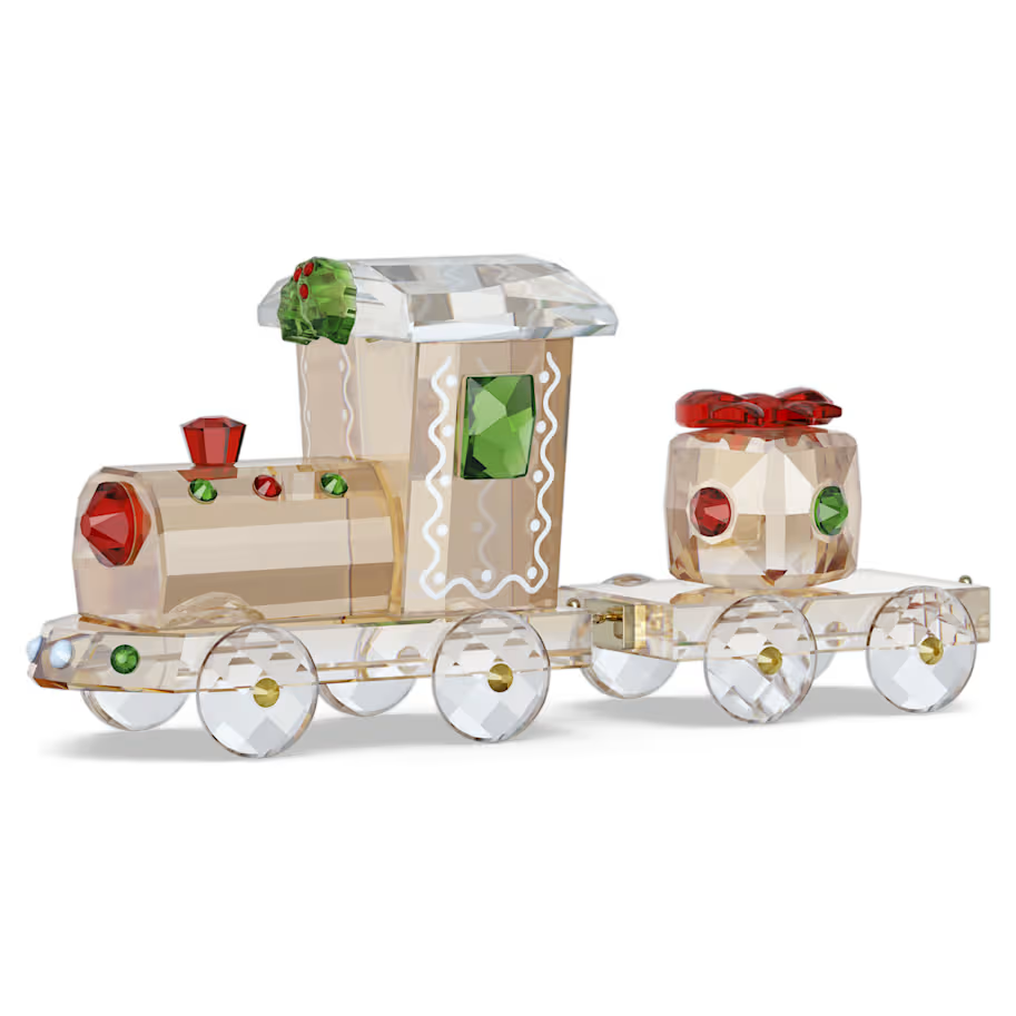De Holiday Cheers-trein is een verzamelobject om jaar na jaar van te genieten. De reis breidt zich elk jaar uit met speciale nieuwe wagons, waardoor uw display elk seizoen langer en magischer wordt.Deze locomotief met wagon is het onmisbare startstuk van de collectie. Hij is uitgevoerd in een warme peperkoektint met 801 facetten, draagt het allereerste kerstcadeau en heeft vrolijke kleuren en hulstblaadjes voor een gezellig tafereel. Een perfecte manier om nostalgie, feestelijke charme en vreugde in huis te halen. Decoratief voorwerp. Geen speelgoed. Niet geschikt voor kinderen onder de 15 jaar.

Artikelnr.: 5732578
Collectie:  Holiday Cheers
Formaat: 3.6 x 2.5 x 8.3 cm
Ontwerper:  Bettina Fuchs
Materiaal:  Kristallen, Metaal met goudkleurige afwerking
Kleur:  Meerkleurig