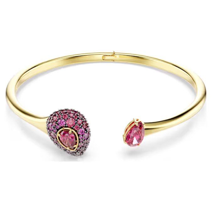 Deze open armband vangt de Sublima-kunst van zelfexpressie op een levendige manier, met een verloop van rode Swarovski Zirkonia die passie en vitaliteit symboliseren. Draag hem met de bijpassende cocktailring of oorbellen om uw stijl een kleurrijke boost te geven. De Sublima-sieraden zijn ge&iuml;nspireerd door de eb en vloed van de natuur en zorgen voor een magisch effect dat in elk product tot leven komt door organische vormen en beeldschone precisieslijpvormen.

Artikelnr.: 5752895
Collectie: Sublima
Lengte: 16.6 cm
Binnenste diameters: 5.8 x 4.8 cm
Formaat motief: 1.5 x 2.7 cm
Afstand opening: 4.3 cm
Materiaal: 18k gouden afwerking, Cubic zirconia
Kleur: Rood
Type sluiting: Wonderclick