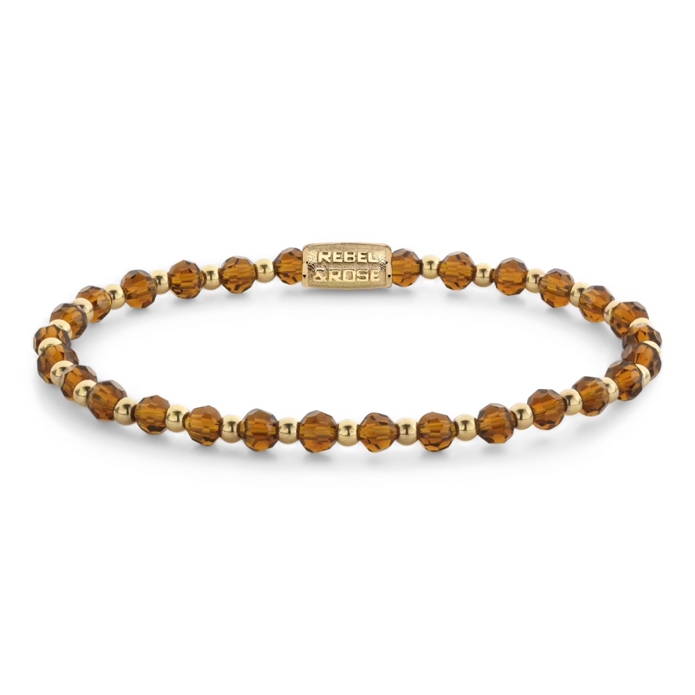 Bead armband, handgemaakt van 4mm stenen (Glas Rock, RVS ion-gold plated) met een 18 karaat goud ion-plated edelstalen sluiting. Het Rebel & Rose sieraad is makkelijk te combineren met onze andere kralenarmbanden.