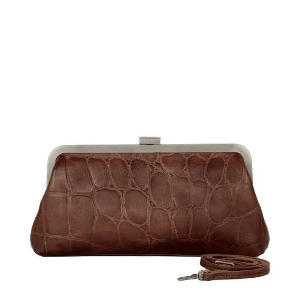 Clutch Cherice donkerbruin &ndash; leren clutch met twee looks
Twee kanten, twee looks. Clutch Cherice in donkerbruin is een compacte en veelzijdige leren clutch van soepel Apache leer. Aan de ene zijde zorgt de stoere crocostructuur voor een opvallende uitstraling, terwijl de andere zijde is uitgevoerd in glad leer voor een rustige en elegante look. Zo bepaal je zelf welke kant het beste bij je outfit past.
Het metalen frame en de verfijnde dirty silver details geven deze leren clutch een moderne en luxe uitstraling. Dankzij het compacte formaat neem je je belangrijkste essentials gemakkelijk mee, zonder dat de tas aan stijl hoeft in te leveren.

Elegant &eacute;n veelzijdig
Het hoofdcompartiment sluit met een stijlvolle metalen framesluiting. Binnenin vind je een ritsvak en een praktisch insteekvak, zodat je kleine essentials overzichtelijk kunt opbergen.
Draag Cherice in de hand voor een elegante avondlook of bevestig het afneembare schouderbandje wanneer je liever je handen vrij hebt. Zo is deze compacte tas geschikt voor een avondje uit, een feestje, diner of een andere bijzondere gelegenheid.

Productdetails
Model: Cherice
Kleur: Donkerbruin
Materiaal: Apache leer
Afmetingen: 24,5 x 3,5 x 13 cm
Exterieur: hoofdcompartiment met metalen framesluiting
Interieur: ritsvak en insteekvak
Schouderband: afneembaar schouderbandje
Bijzonderheden: &eacute;&eacute;n zijde met crocostructuur en &eacute;&eacute;n zijde van glad leer
Details: metalen frame en dirty silver details
Draagmogelijkheden: in de hand of over de schouder
Clutch Cherice is de perfecte leren avondtas voor wie houdt van een compacte tas met een luxe uitstraling en verrassende veelzijdigheid. Twee verschillende looks in &eacute;&eacute;n tas &ndash; klein van formaat, groots in karakter.