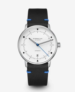 Automaat in Bauhaus stijl, zilverkleurige kast en beige wijzerplaat, zwart leren band.
Horloge heeft een oplichtende wijzerplaat en wijzers in het donker.