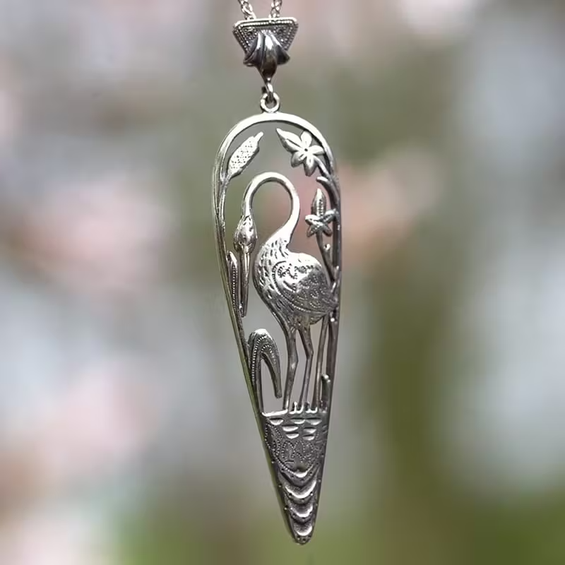 zilveren hanger kraanvogel met zilveren collier
