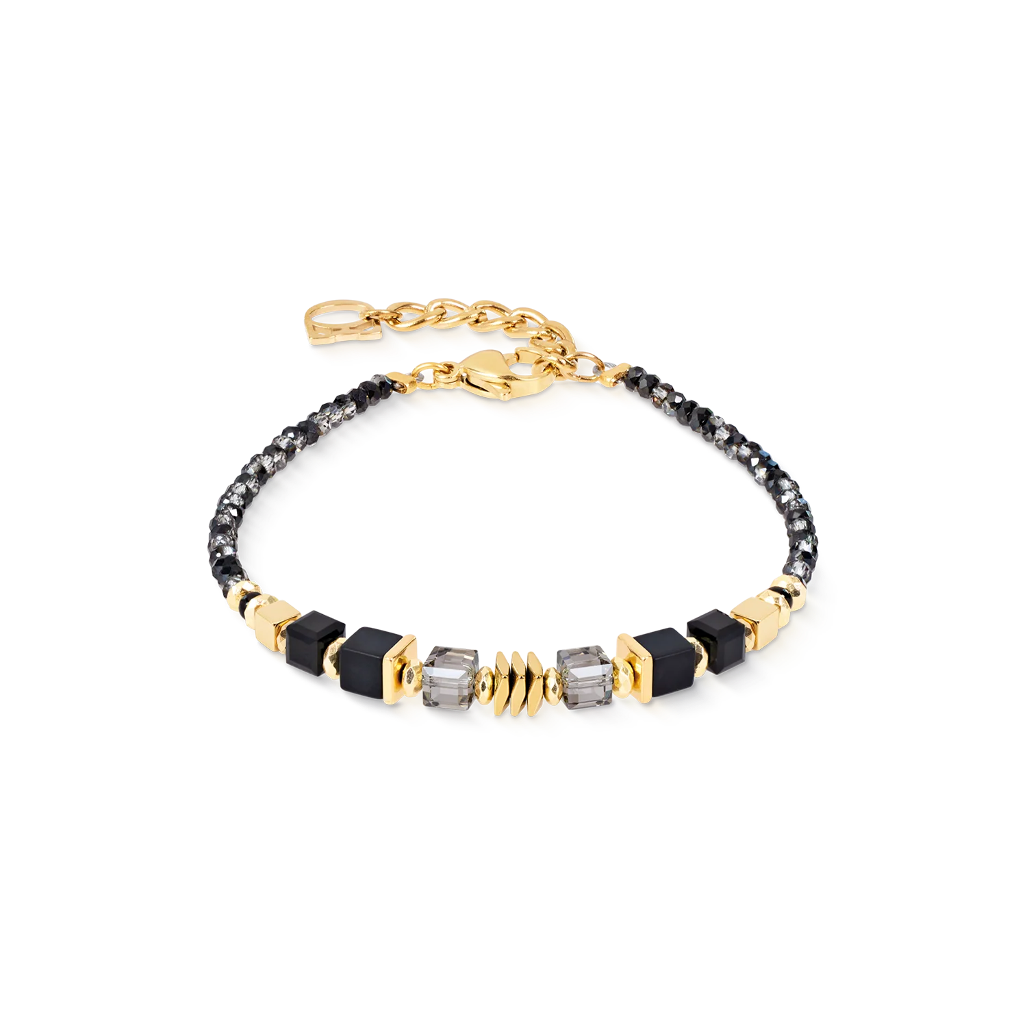 Armband Wave Cube Flow goud-zwart
De Wave Cube Flow armband in goud-zwart combineert vloeiende lijnen met gedurfde contrasten en cre&euml;ert zo een verfijnd, eigentijds designsieraad. Diepzwarte tinten, warme gouden accenten en sprankelende kristallen zijn in een harmonieus ritme gerangschikt, dat de elegante beweging weerspiegelt die centraal staat in de Wave Cube Flow collectie. Het resultaat is een armband met een modern karakter en tijdloze aantrekkingskracht. Zorgvuldig uitgebalanceerde geometrische elementen cre&euml;ren subtiele lichtreflecties, terwijl de armband een luchtige, elegante uitstraling behoudt. Of de armband nu los gedragen wordt of samen met de bijpassende ketting en oorringen, hij completeert een geco&ouml;rdineerde sieradenset die architectonisch design en verfijnd vakmanschap viert. Onyx, goudkleurig hematiet, Swarovski&reg; kristallen, gefacetteerd glas en hoogwaardig goudkleurig roestvrij staal verenigen hedendaagse elegantie met de onmiskenbare designsignatuur van COEUR DE LION.

Elk sieraad dat u bij COEUR DE LION bestelt, wordt geleverd in een luxe designverpakking en met een echtheidscertificaat.